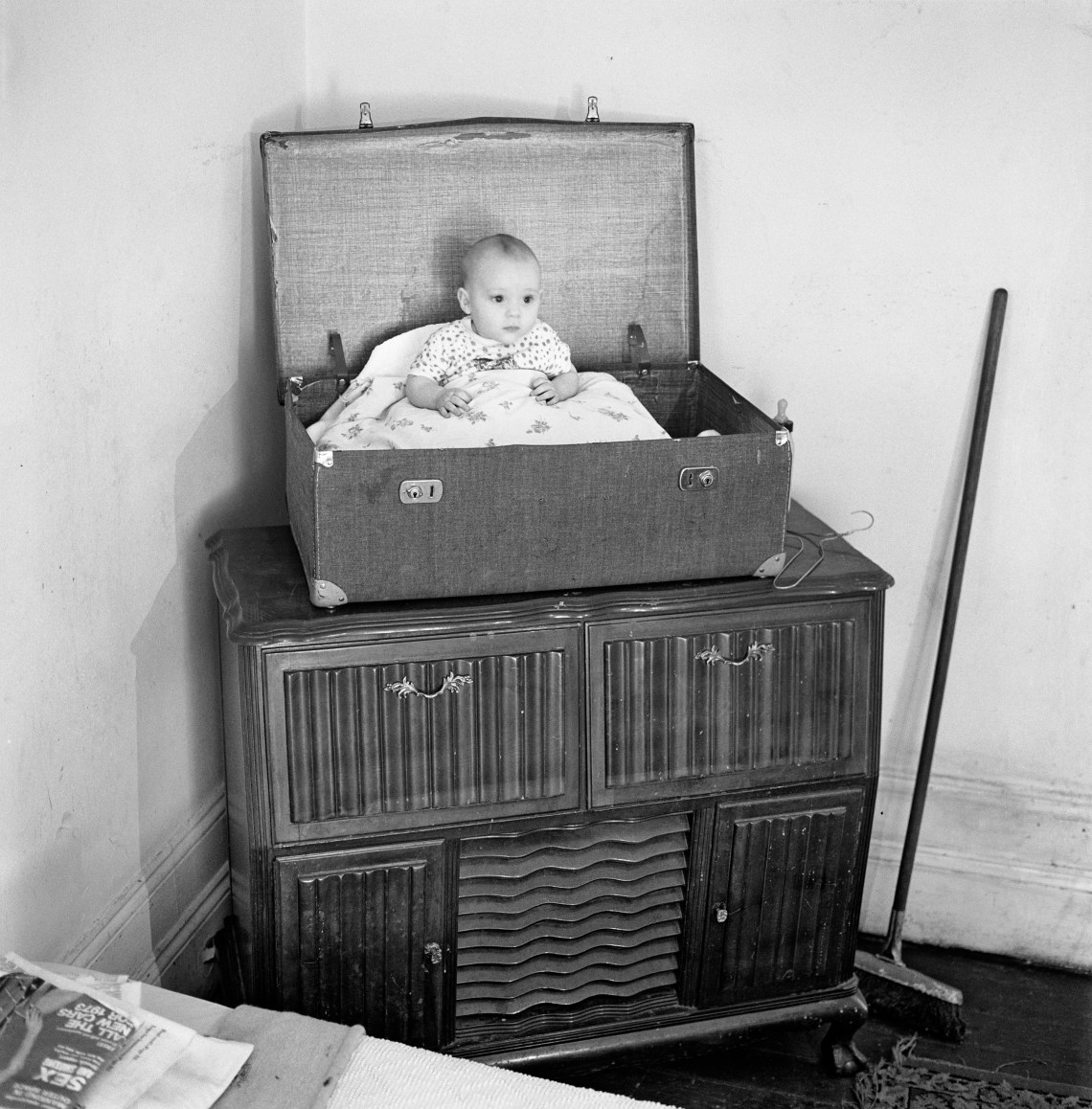 A baby and his father in a rooming house on Abel Road, Hillbrow